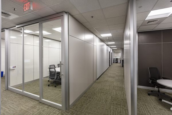 Image of solid and glass architectural walls with a glass door
