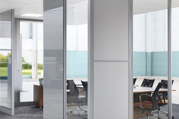 Image of conference room with both solid and clear architectural glass walls